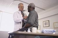 Doctor examining patient in office