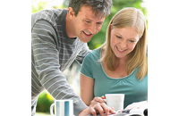 man and a woman going over some printed information