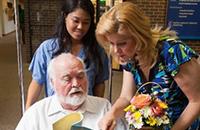 Male patient and female family member being discharged from a hospital