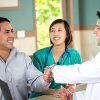 health care professionals greet a patient