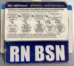 A badge buddy, showing C. diff protocols is attached to all staff badges.