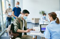 Young man signing medical agreement